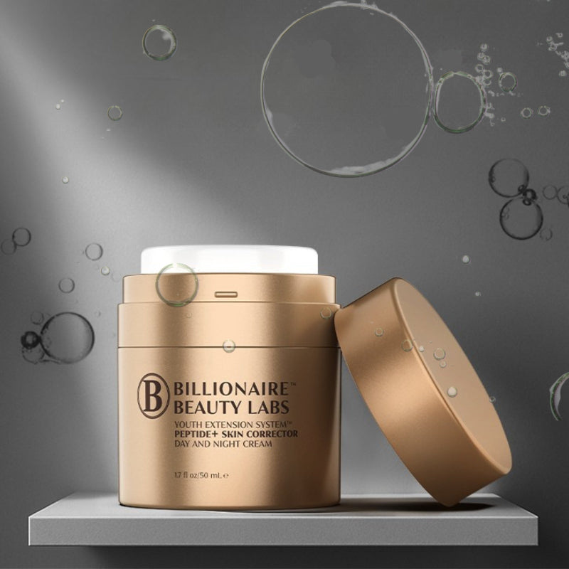 Gold jar of Billionaire Beauty Labs cream on a gray background with bubbles