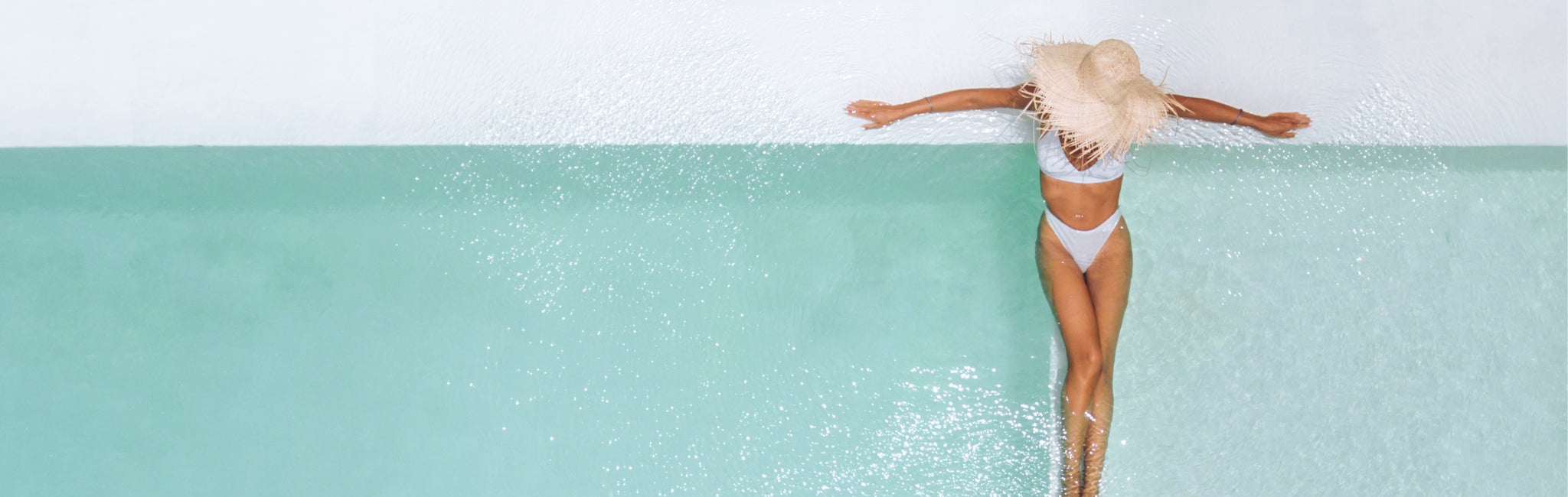 Person lying on a pool with a white background